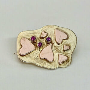 Yellow and pink gold hearts pin with rubies