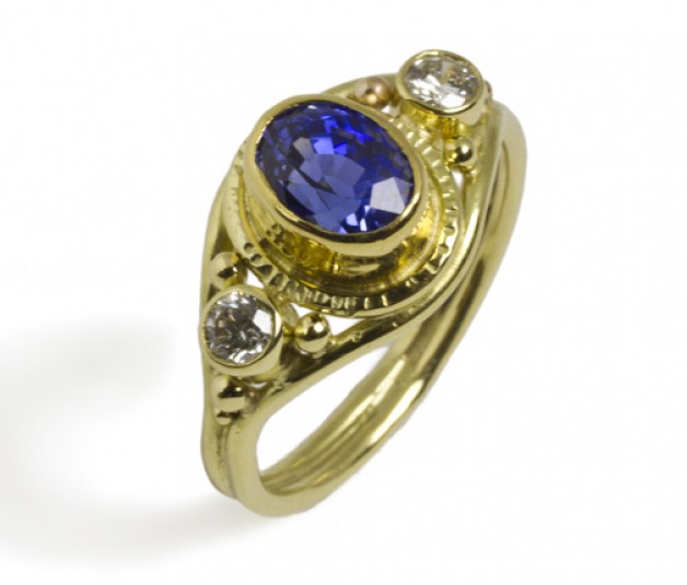 18k and 22k yellow gold with natural color blue sapphire and diamonds. See this ring at Daniel R. Spirer Jewelers in Boston
