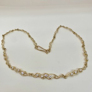 My moonbeams necklace is 18k yellow gold with .71 ct. t.w. of ideal cut "E" color VS clarity diamonds. It measures 16.50" long. Each link is individually done so every necklace is unique. 