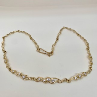 My moonbeams necklace is 18k yellow gold with .71 ct. t.w. of ideal cut "E" color VS clarity diamonds. It measures 16.50" long. Each link is individually done so every necklace is unique. 