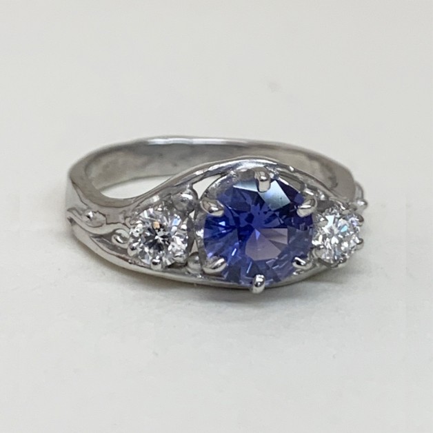 Purple/blue color shift sapphire ring