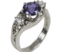 Purple sapphire and diamond engagement ring in 950 platinum