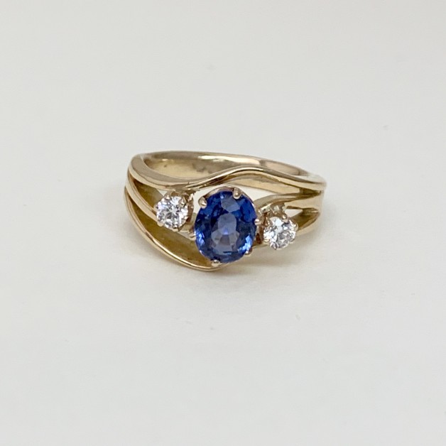 Blue sapphire wave ring with diamonds