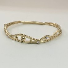 Gold adjustable bangle bracelet with diamonds