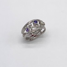 Platinum ring with purple sapphires and diamonds