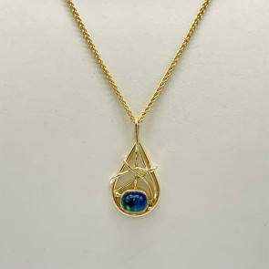 Madagascar moonstone (N) set in a 22k gold bezel