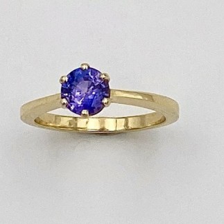18k yellow gold, simple,  hand built solitaire ring with a natural color .98 ct. Sri Lankan purple sapphire.