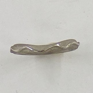 950 platinum moonbeam wire wedding band with curve to fit around an engagement ring, a sandblasted background,  3mm wide 