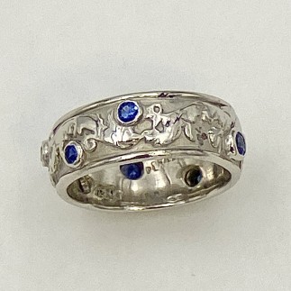950 platinum ring with an Elizabethan design with .43ct (TW) blue sapphires