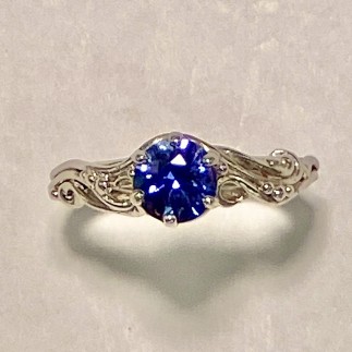 950 platinum vine design ring with a 1.12 ct. (H) purple/blue color change sapphire.