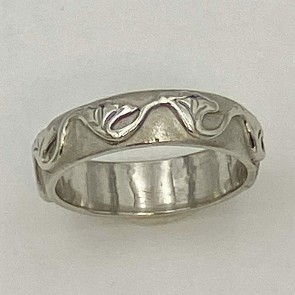 950 platinum 5mm wide wedding band with a gingko leaf wave design.