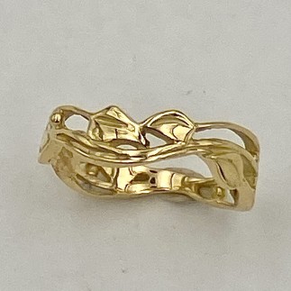 18 k yellow gold with leaf and vine pattern.