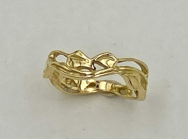 18 k yellow gold with leaf and vine pattern.
