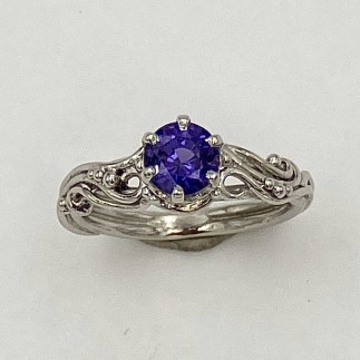 950 platinum viney ring with a 1.04 ct., natural color, Sri Lankan deep purple sapphire.