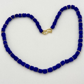 Natural color Afghani lapis lazuli beads (TW 149 cts.)with 22k yellow gold spacers with a 22k yellow gold clasp. Measures 19 inches long.