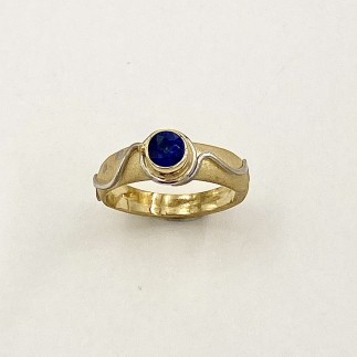 Sandblasted 18k yellow gold ring with 950 platinum accents and a .78ct. fine dark blue sapphire (H) in this unique Daniel Spirer design
