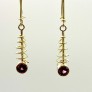 18k yellow gold coil earrings with Rhodolite garnets.  1.75 inches long.