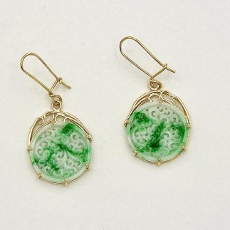 Hand carved 10.47ct. jadeite earrings in 18k yellow gold. 1.5 inches long. Jadeite is 3/4 inch circle