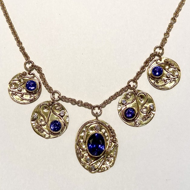18k yellow gold tanzanite necklace with diamond accents