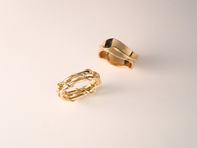 Boston jeweler Daniel R. Spirer creates unique wedding rings such as these 18k yellow gold bands
