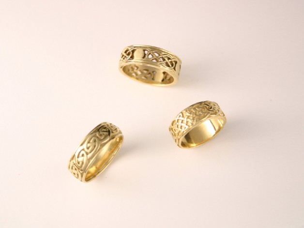 Daniel R. Spirer Jewelers of Boston, Cambridge offers unique wedding rings such as these 18k yellow gold bands