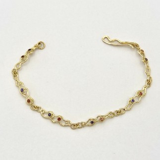 18k yellow gold link bracelet, 7.5 inches long with .27 cts. (TW) natural color orange sapphires and .22 cts. (TW) natural color purple sapphires.