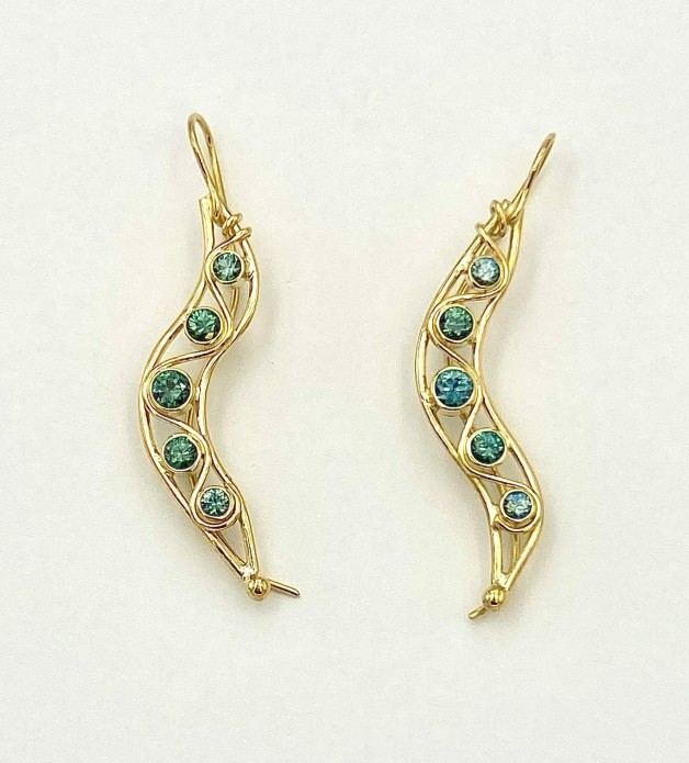 As in nature every peapod is unique. Stunning teal color Montana sapphires, 2 carats (TW), (H) in an 18k yellow gold cascade. Earring length is 2 inches.