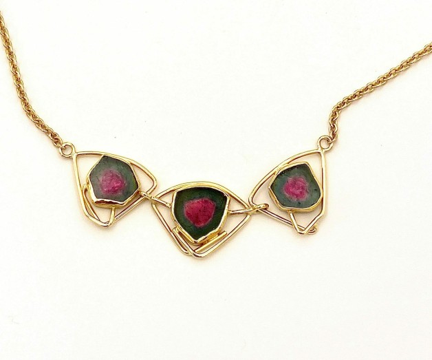 18 and 22 kt yellow gold necklace with three watermelon tourmalines. The necklace measures 17.5 inches long.