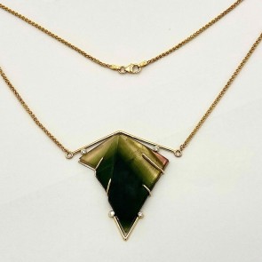 18k yellow and white gold necklace with Dieter Lorenz carved multi color tourmaline with four E color, VS clarity diamonds .18ct. (TW).