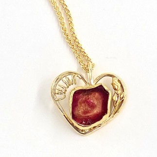 18k yellow gold heart pendant with an 8.19 ct. pink watermelon tourmaline set in 22k gold. Chain priced separately.