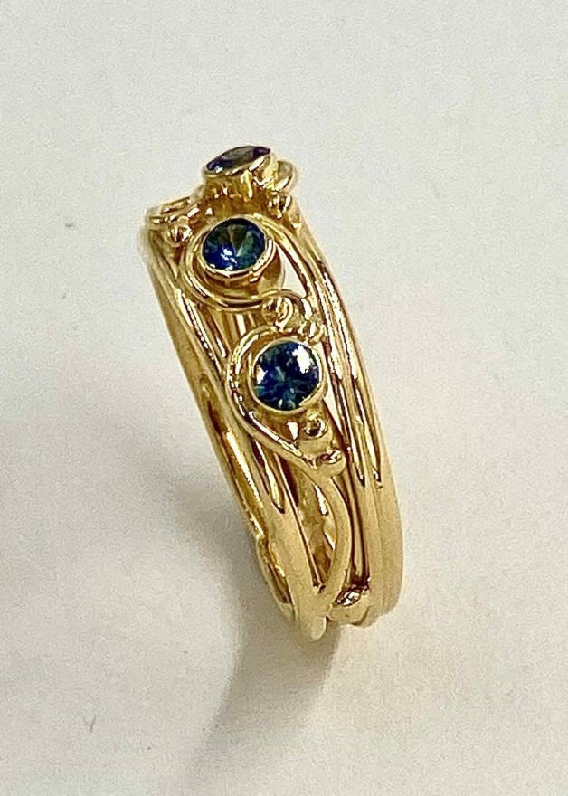 Three Montana Teal Sapphire Vine Ring Side View