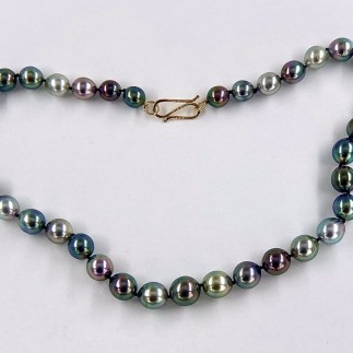 18 3/4 inch long graduated strand of black, baroque, multicolored South Sea pearls 9-12 mm in size with 18k yellow gold S clasp