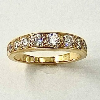 18k yellow gold, graduated, bead set diamond ring with a total diamond weight of 1.08 cts., E color, VS clarity