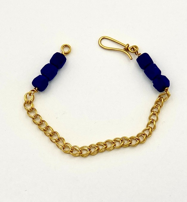22k yellow gold chain bracelet with natural color lapis beads.