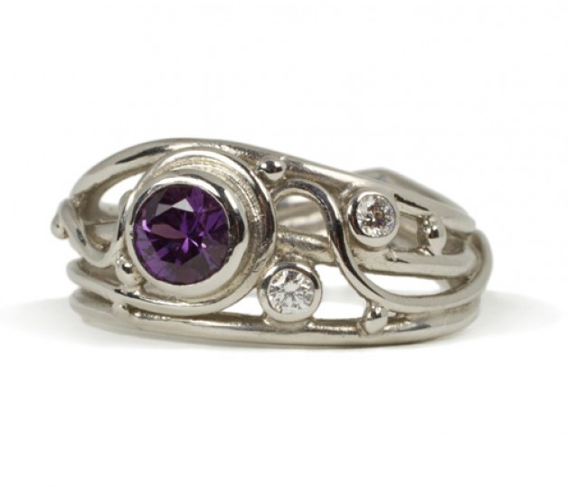 Daniel R. Spirer Jewelers of Boston offeres this 950 platinum ring with purple sapphire and diamond accents