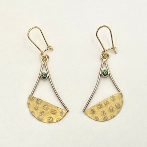 Swing earrings composed of eight layer mokume gane (22k yellow gold and 18k paladium white gold).   The rest of the earrings are a mix of 18k palladium white gold and 18k yellow gold with teal color Montana sapphires (.26 ct. TW). 1.75 inches long.