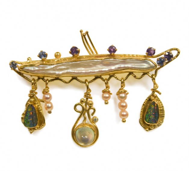 18k and 22k gold pin with freshwater pearls, rainbow moonstone, purple sapphires, boulder opals. This and other brooches available at Daniel R. Spirer Jewelers of Boston, Cambridge