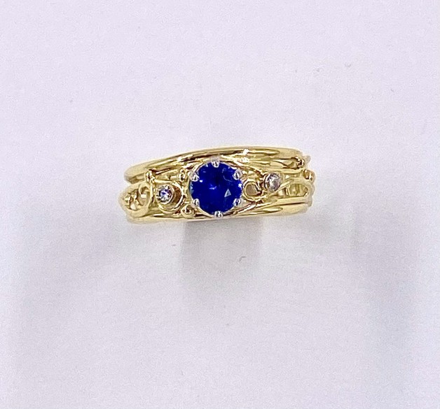 Blue Sapphire Twig Ring with Small Diamond Accents.