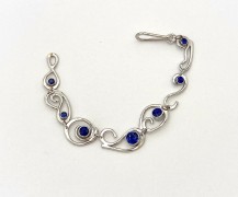 Platinum Loop de Loop Bracelet with Blue Sapphire Platinum Loop de Loop Bracelet with Blue Sapphire