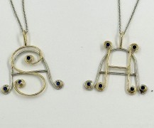 Custom Platinum and 18k Yellow Gold Initial Pendants with Sapphires