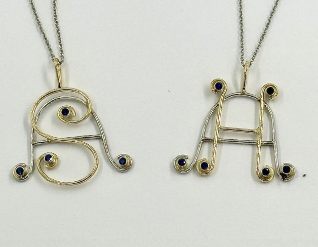 Custom Platinum and 18k Yellow Gold Initial Pendants with Sapphires