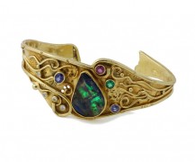 Opal cuff bracelet with boulder opal and assorted gemstones in 18k and 22k