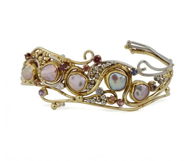 Daniel Spirer Jewelers of Boston, Cambridge offers this 18k yellow and white gold cuff bracelet with Chinese freshwater keshi pearls and fancy colored sapphires