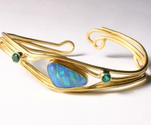 Boulder opal, emerald 22k gold bracelet