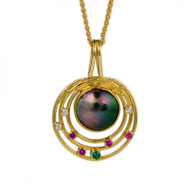 18k and 22k yellow gold pendant with black South Sea mobe pearl, emeralds, pink sapphires and diamonds is available at Daniel R. Spirer Jewelers, Boston