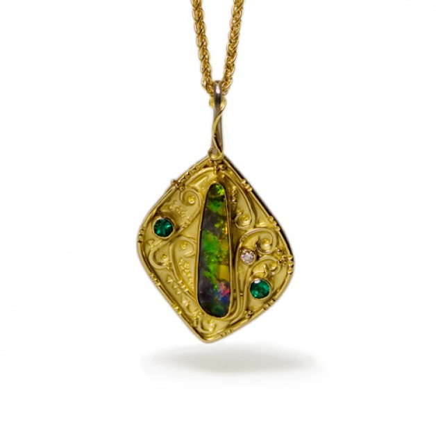 Boston jeweler Daniel Spirer created this pendant of 18k and 22k yellow gold with boulder opal and emeralds