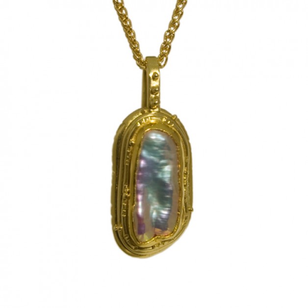 Boston jeweler Daniel Spirer presents this pendant of 18k and 22k yellow gold with freshwater pearl