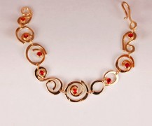 “Loop de Loop Bracelet” 18k gold with orange sapphires