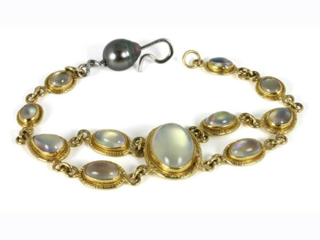 18k and 22k yellow gold bracelet with rainbow moonstones and South Sea black pearl available in the Boston Cambridge area at Spirer Jewelers