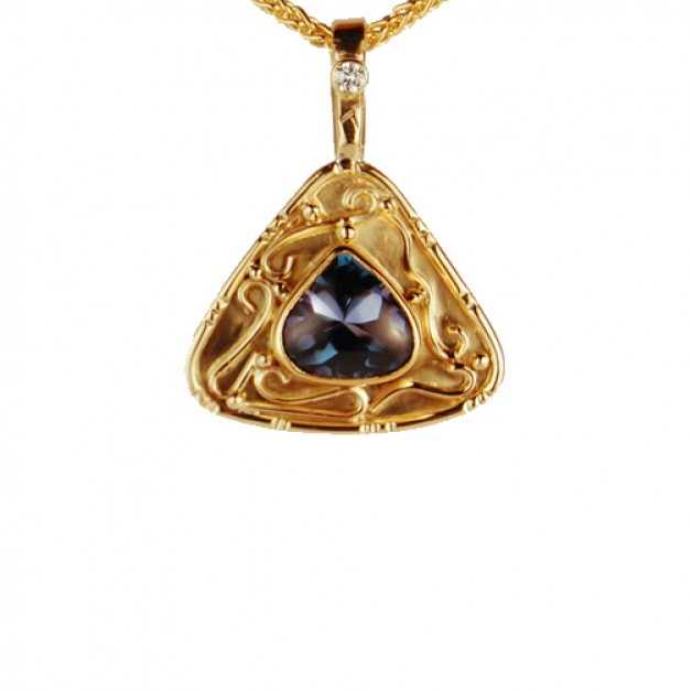 triangular shaped pendant, Tanzanite stone set in 18k gold with diamond accent